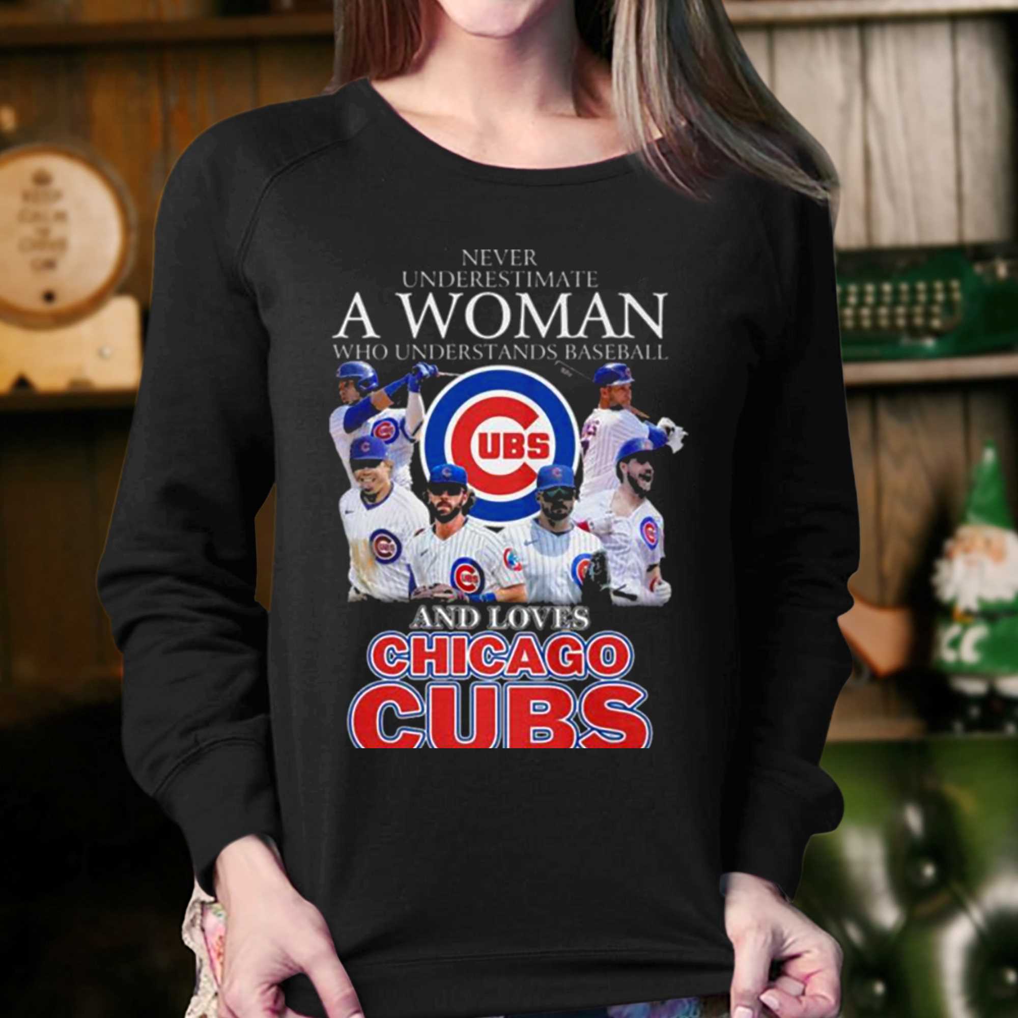 A woman who understands baseball and loves Chicago Cubs shirt